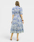 Woman wearing a floral dress on a white background