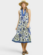 Woman wearing a floral dress with a white background