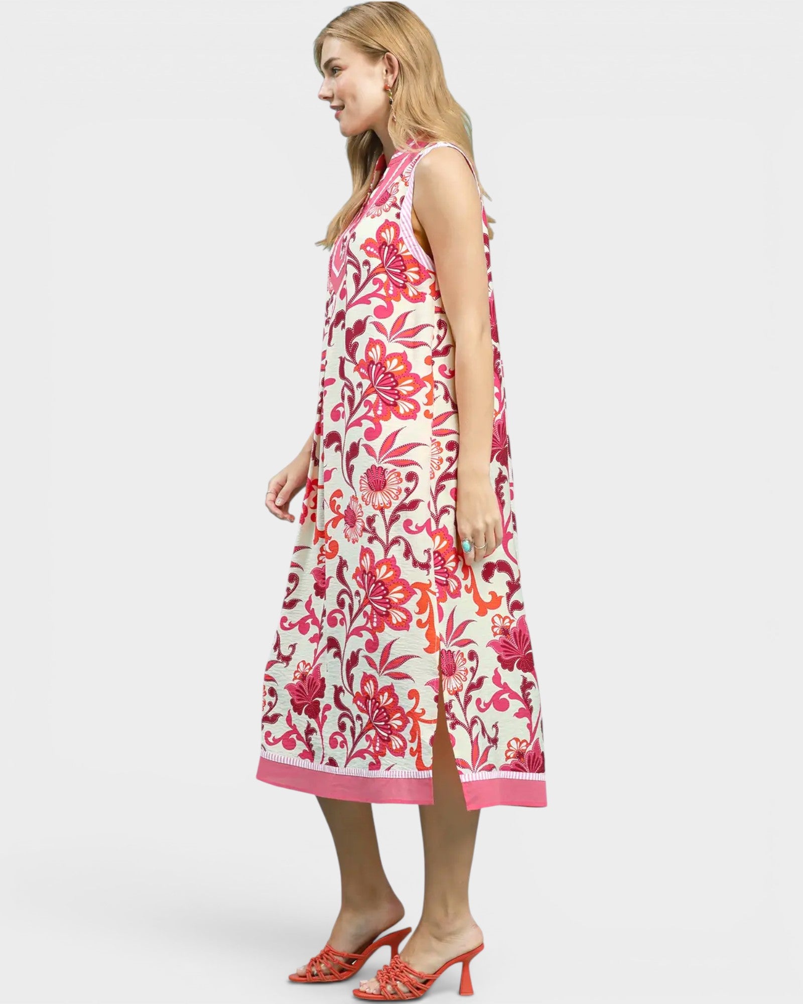 Woman wearing a floral dress on a white background