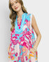Woman wearing a colorful floral dress with a white background