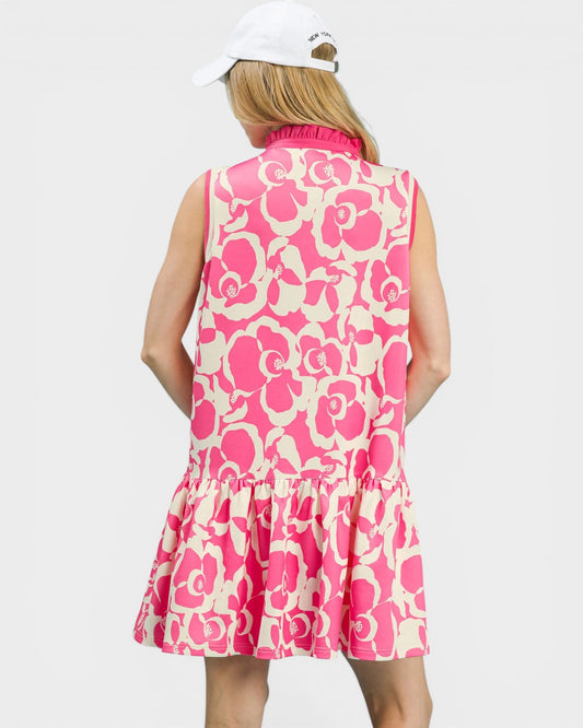 Person wearing a pink floral dress on a white background