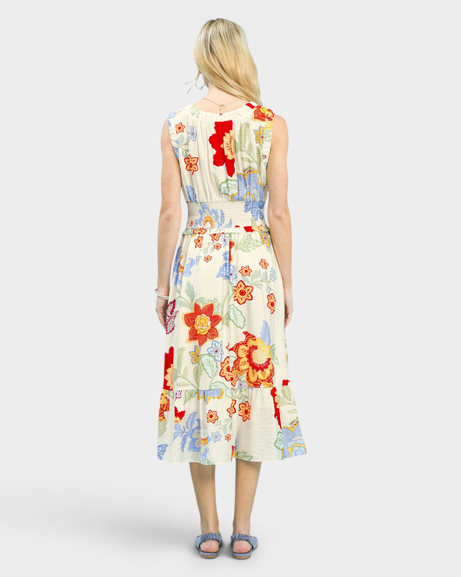 Woman wearing a floral dress on a white background