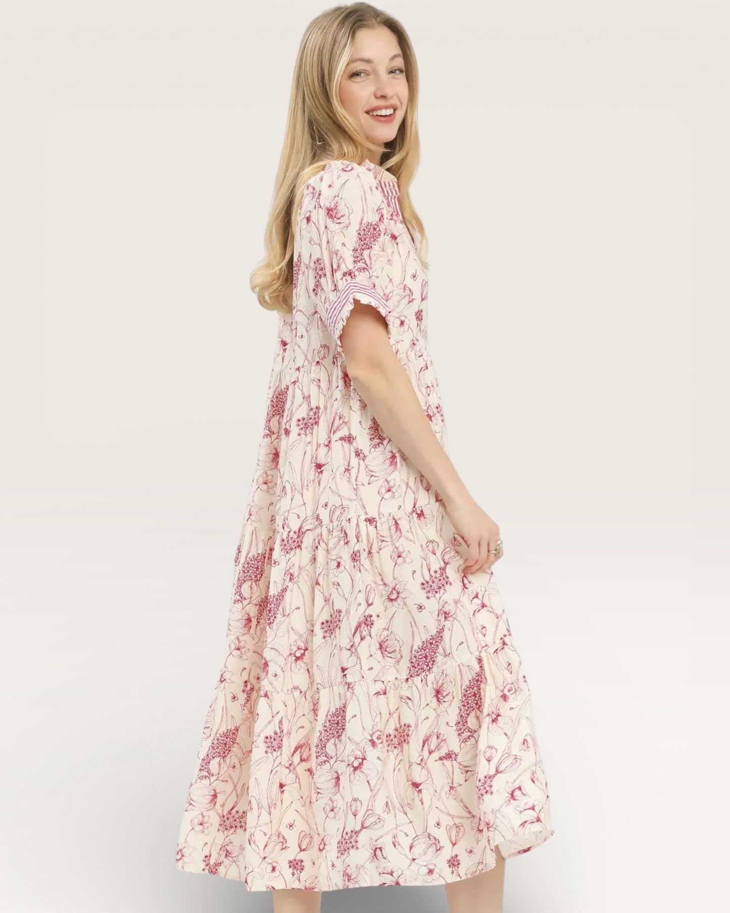 Woman wearing a floral dress on a white background