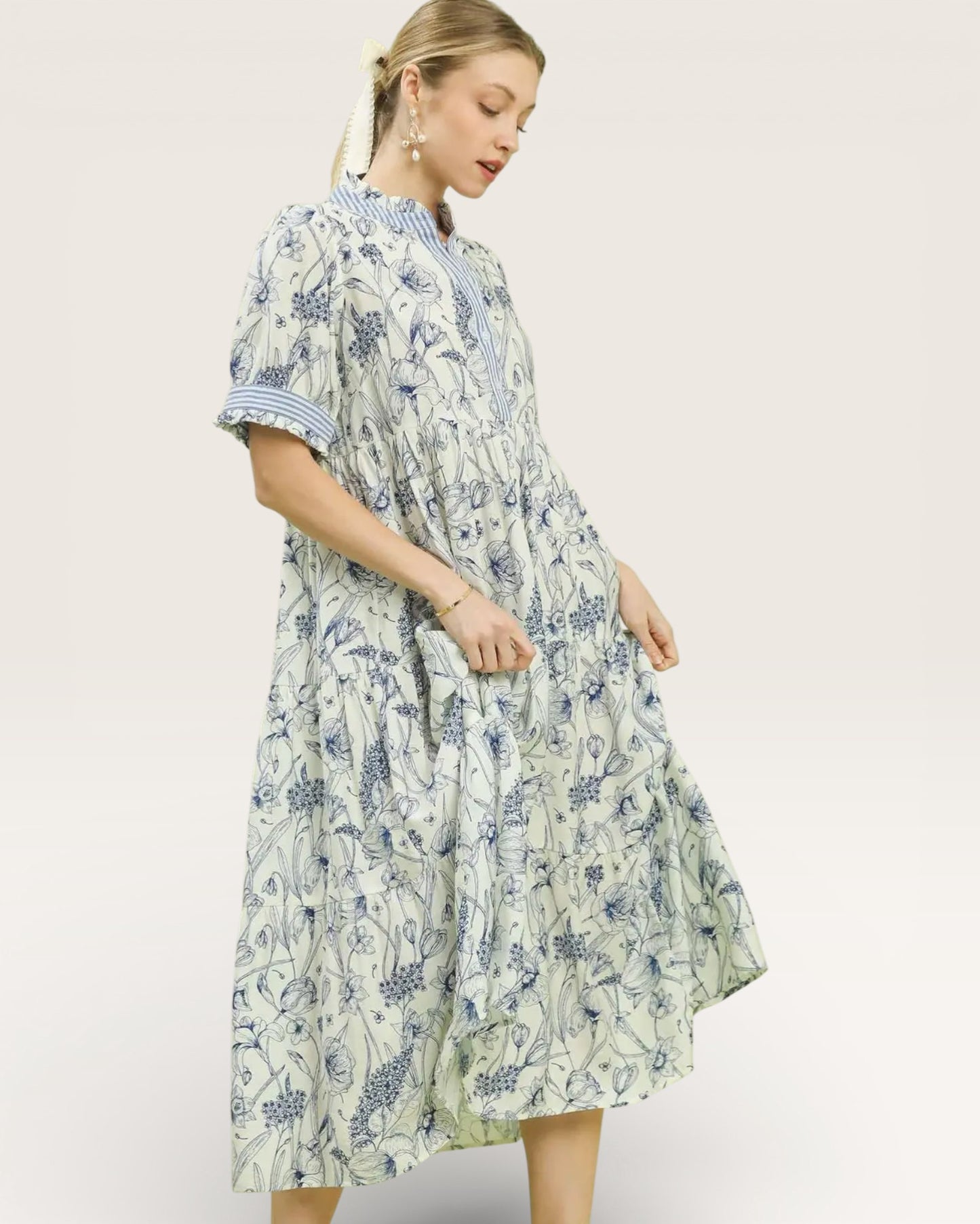 Woman wearing a floral dress on a white background