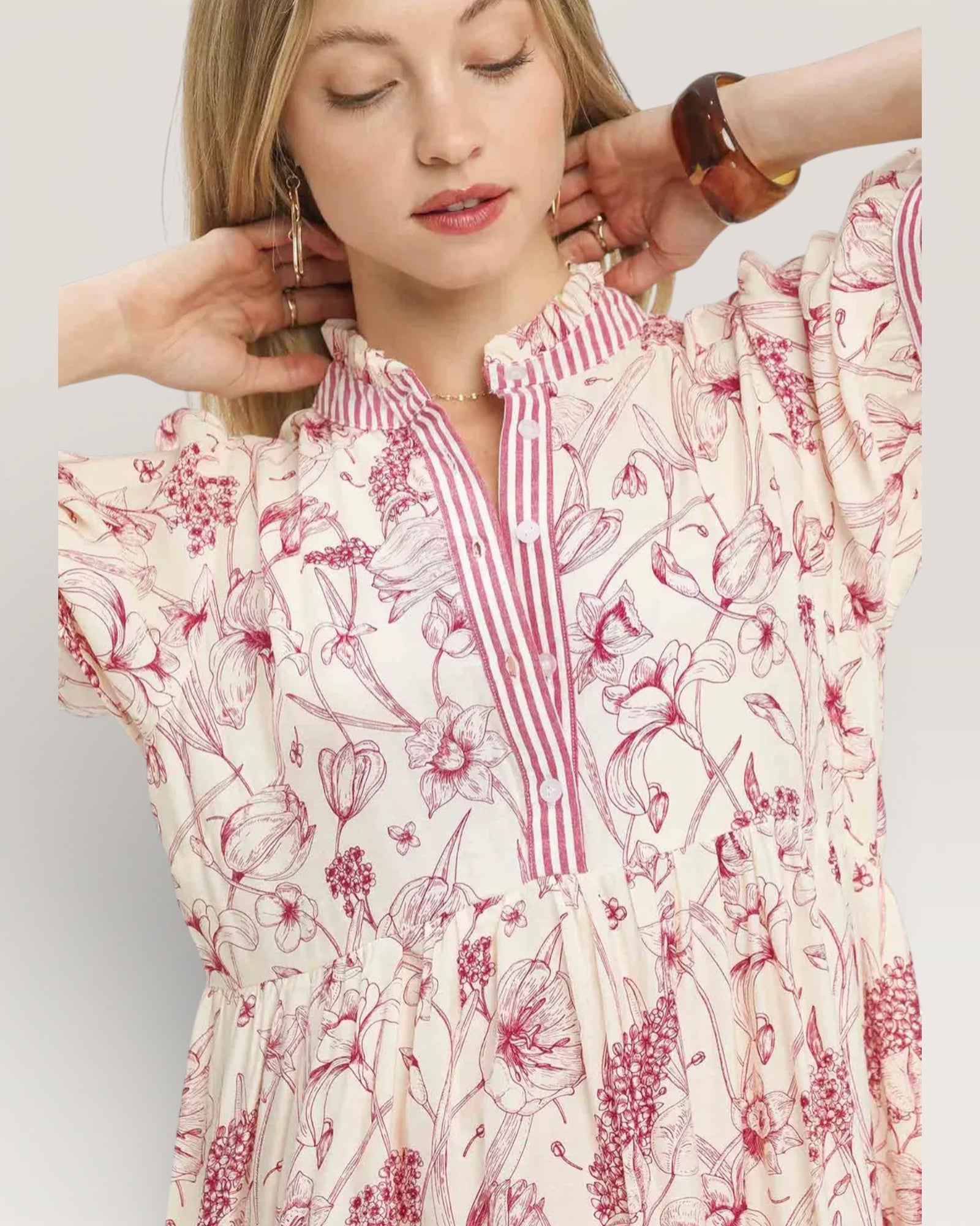 Woman wearing a floral dress with a white background