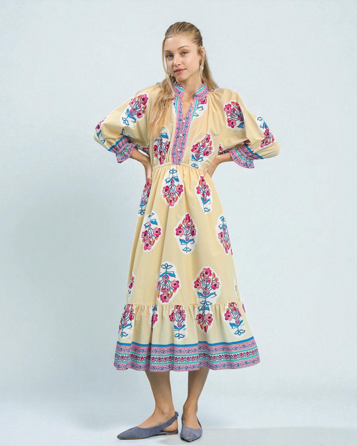 Woman wearing a floral dress on a white background