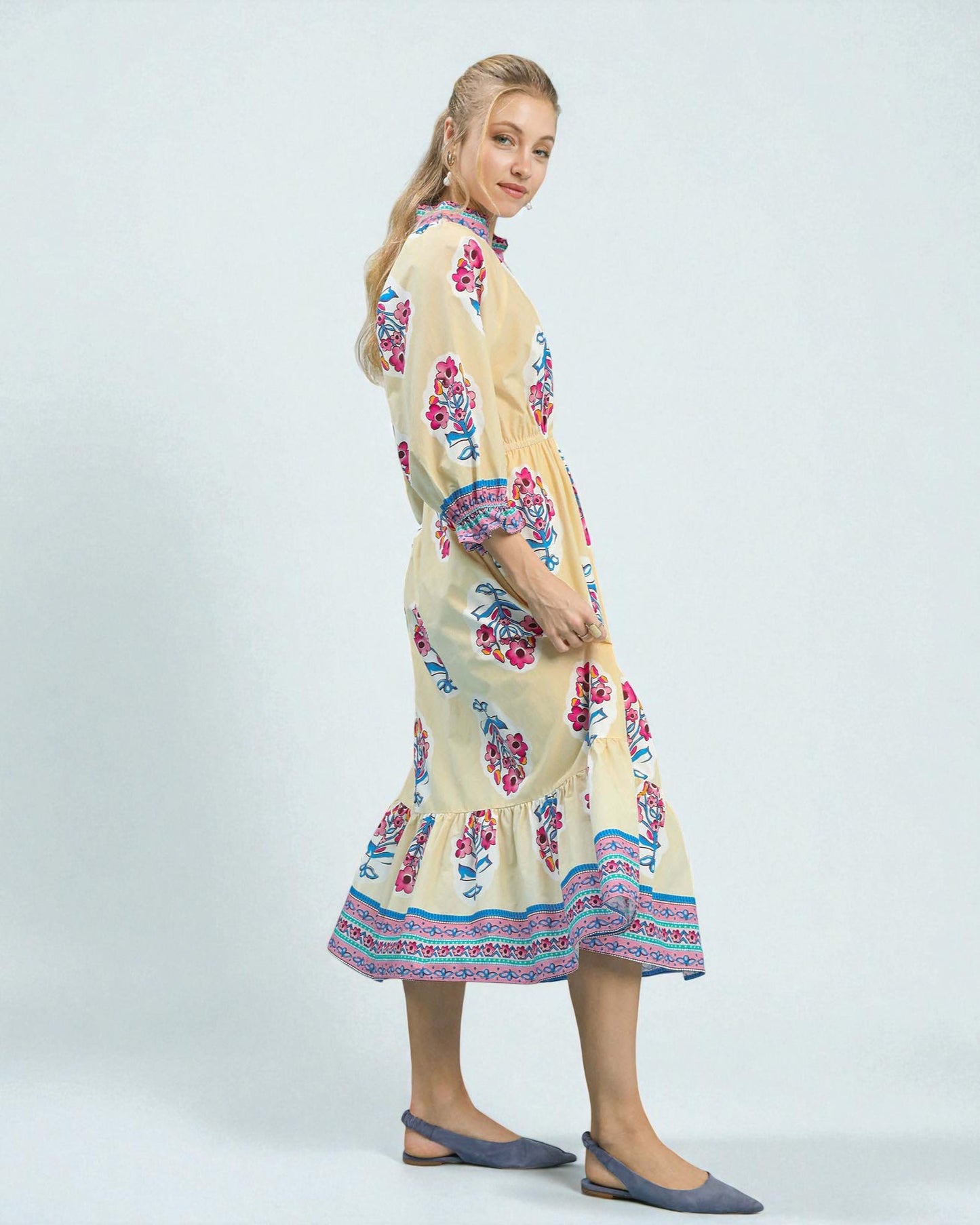 Woman wearing a floral dress on a white background