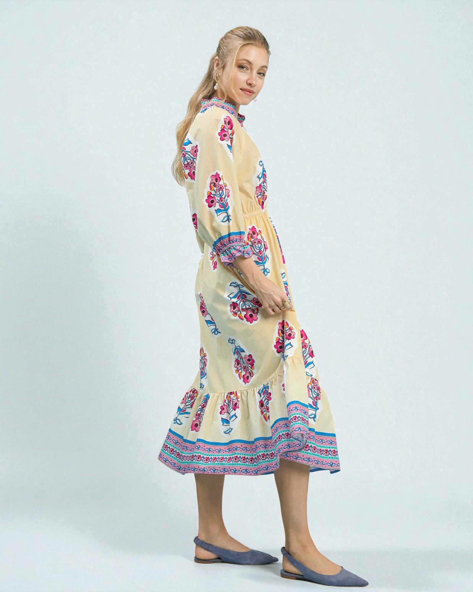 Woman wearing a floral dress on a white background