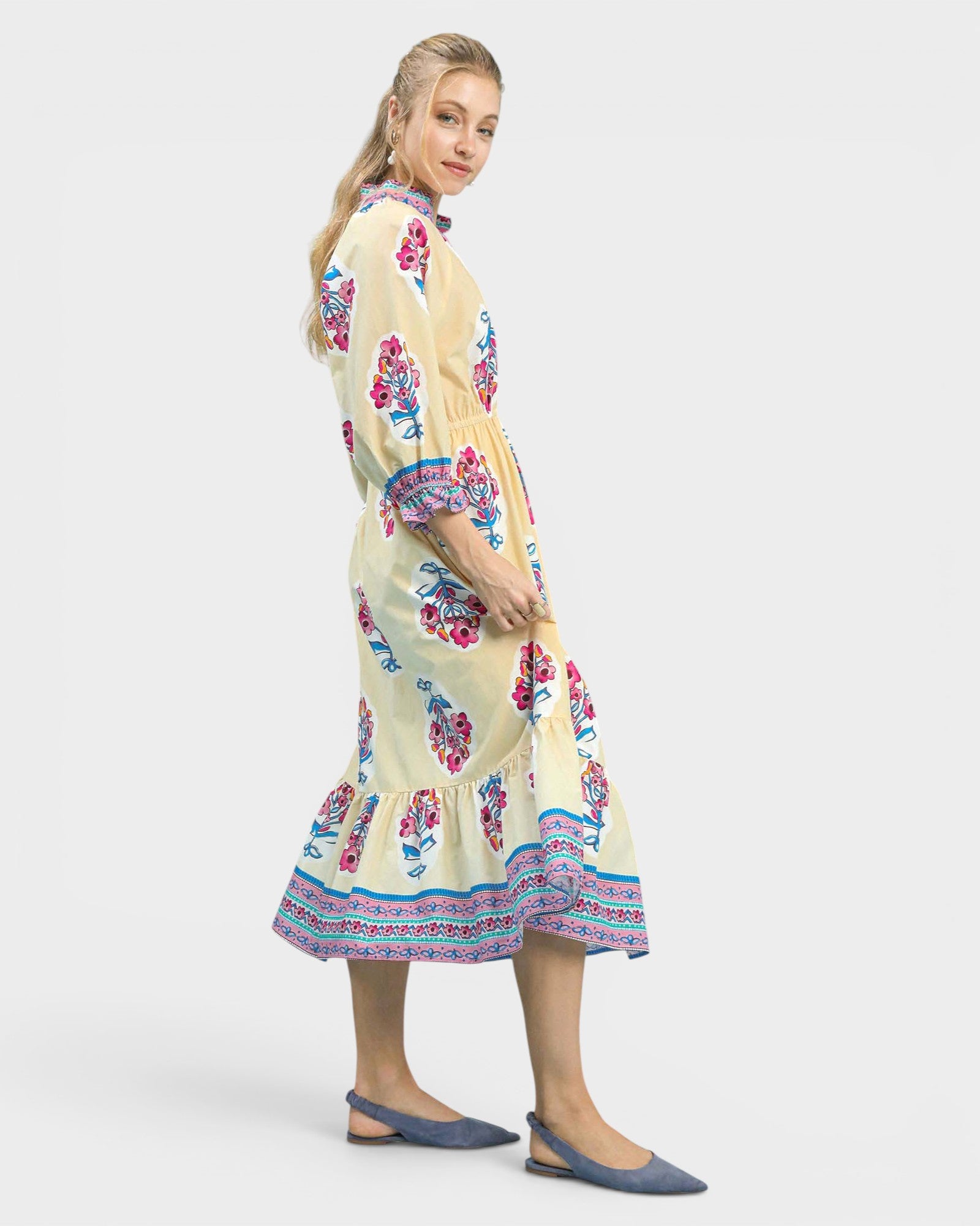Woman wearing a floral dress on a white background