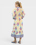 Woman wearing a floral dress with a white background