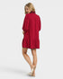 Woman wearing a red dress on a white background