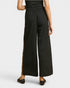 Black wide-leg pants with leopard print side panels on a white background