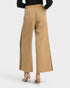 Beige wide-leg pants with leopard print side panels on a white background