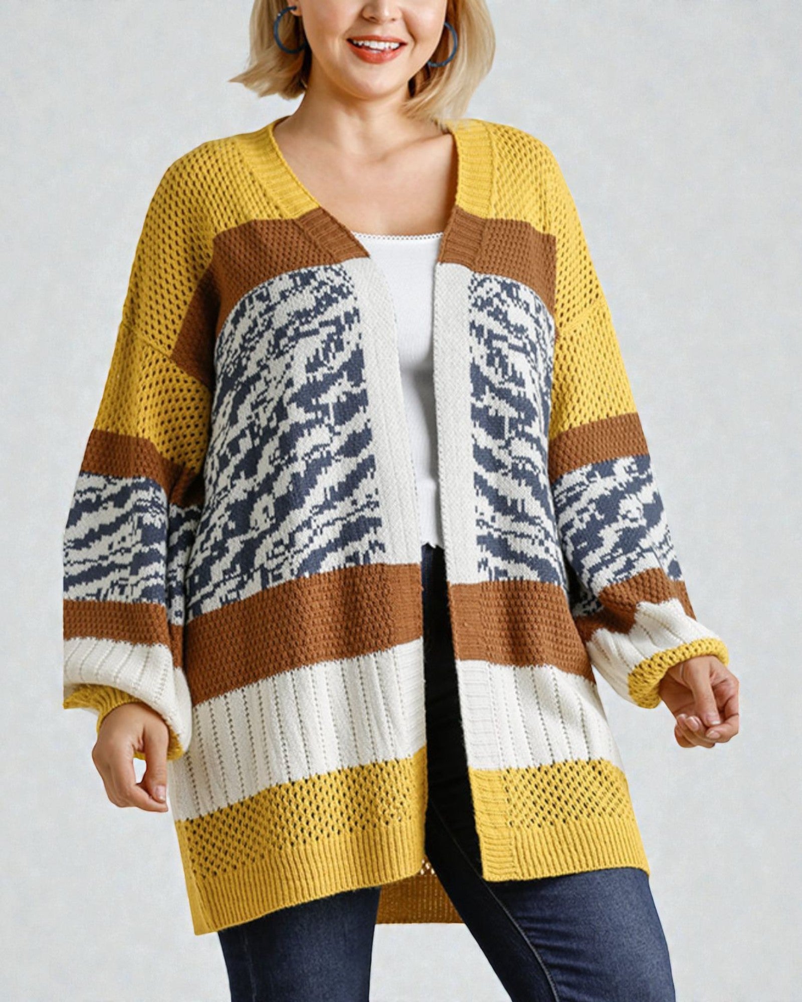 Woman wearing a colorful striped cardigan on a plain background