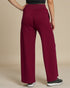 Maroon wide-leg pants worn by a person on a beige background