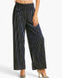A model wearing high-waisted, wide-leg cropped pants with a black and metallic silver vertical stripe pattern, paired with metallic high heels against a plain white background.