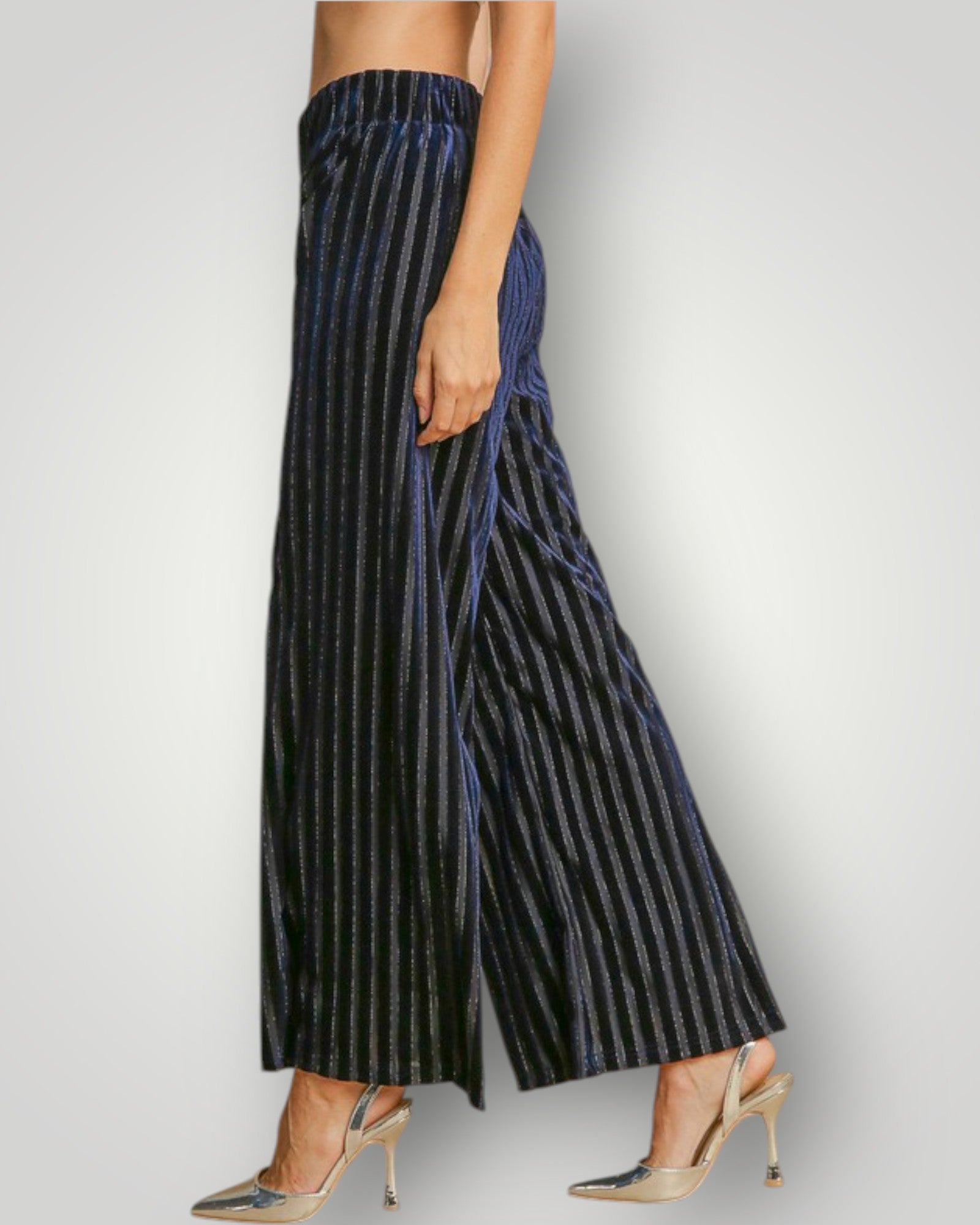 Navy striped pants worn by a person on a light gray background