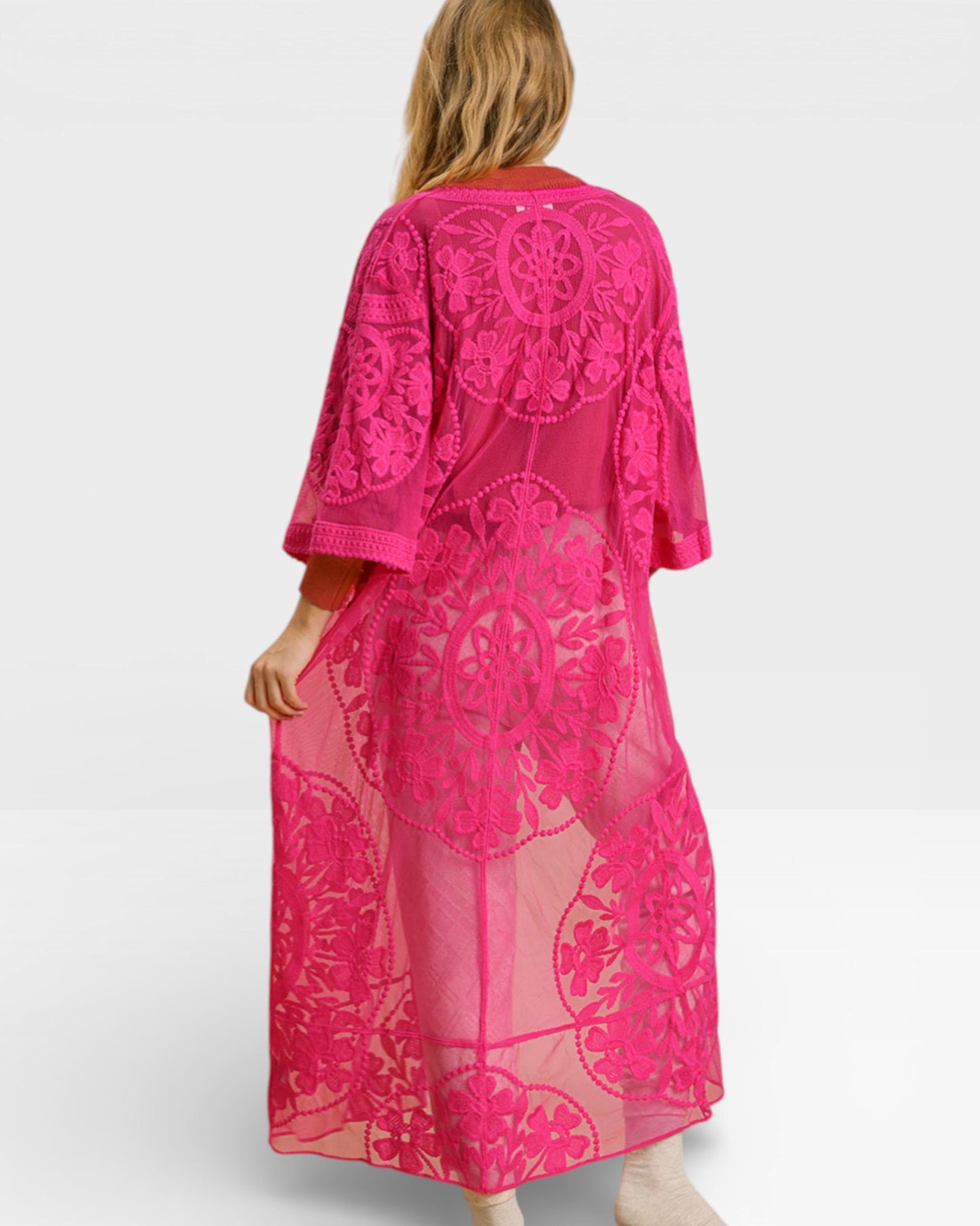 Pink lace dress on a white background