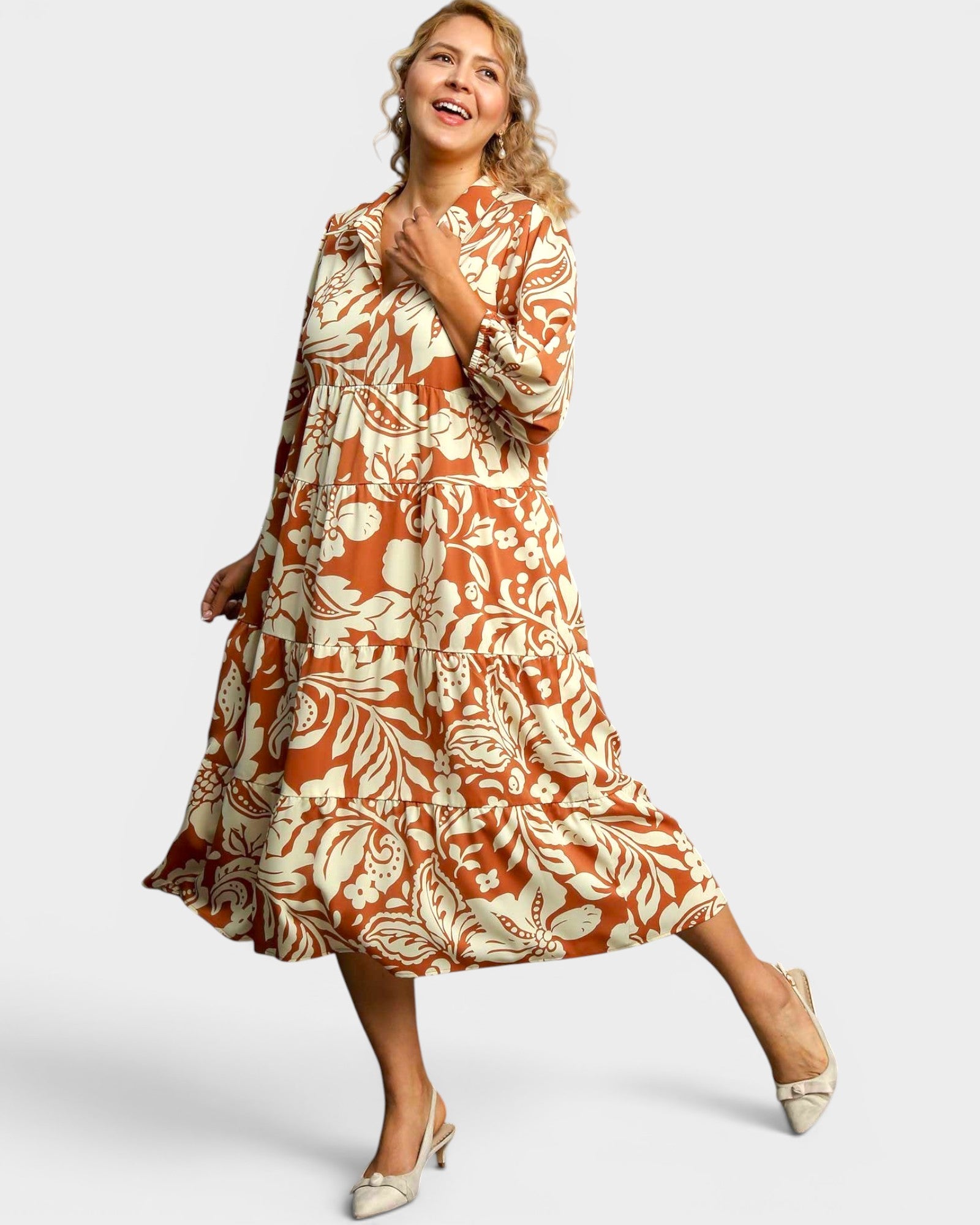 Woman wearing a floral dress on a white background