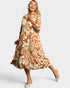 Woman wearing a floral dress on a white background