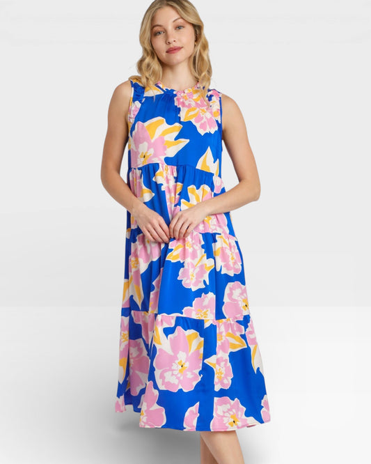 Woman wearing a blue floral dress on a white background