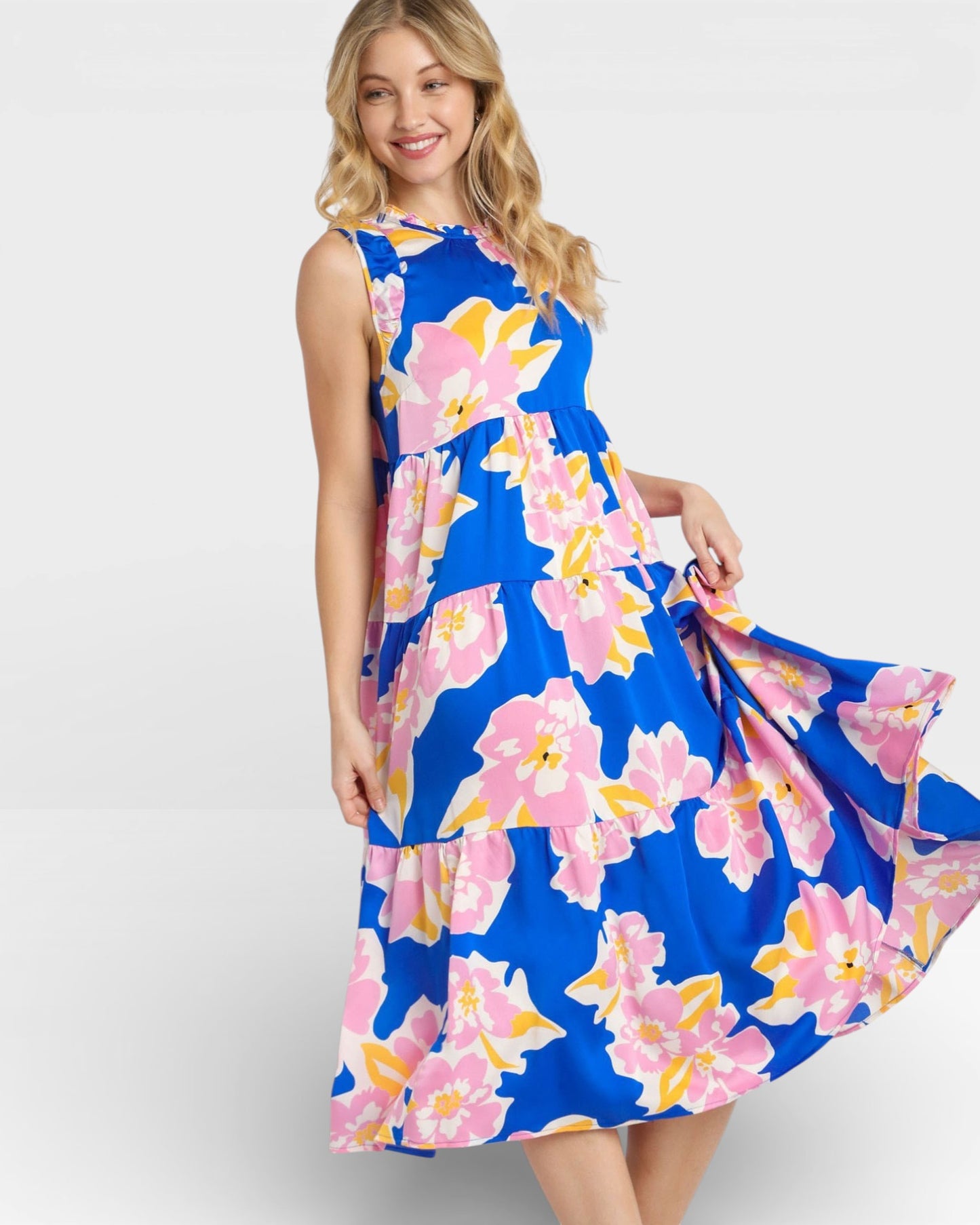 Woman wearing a blue floral dress on a white background