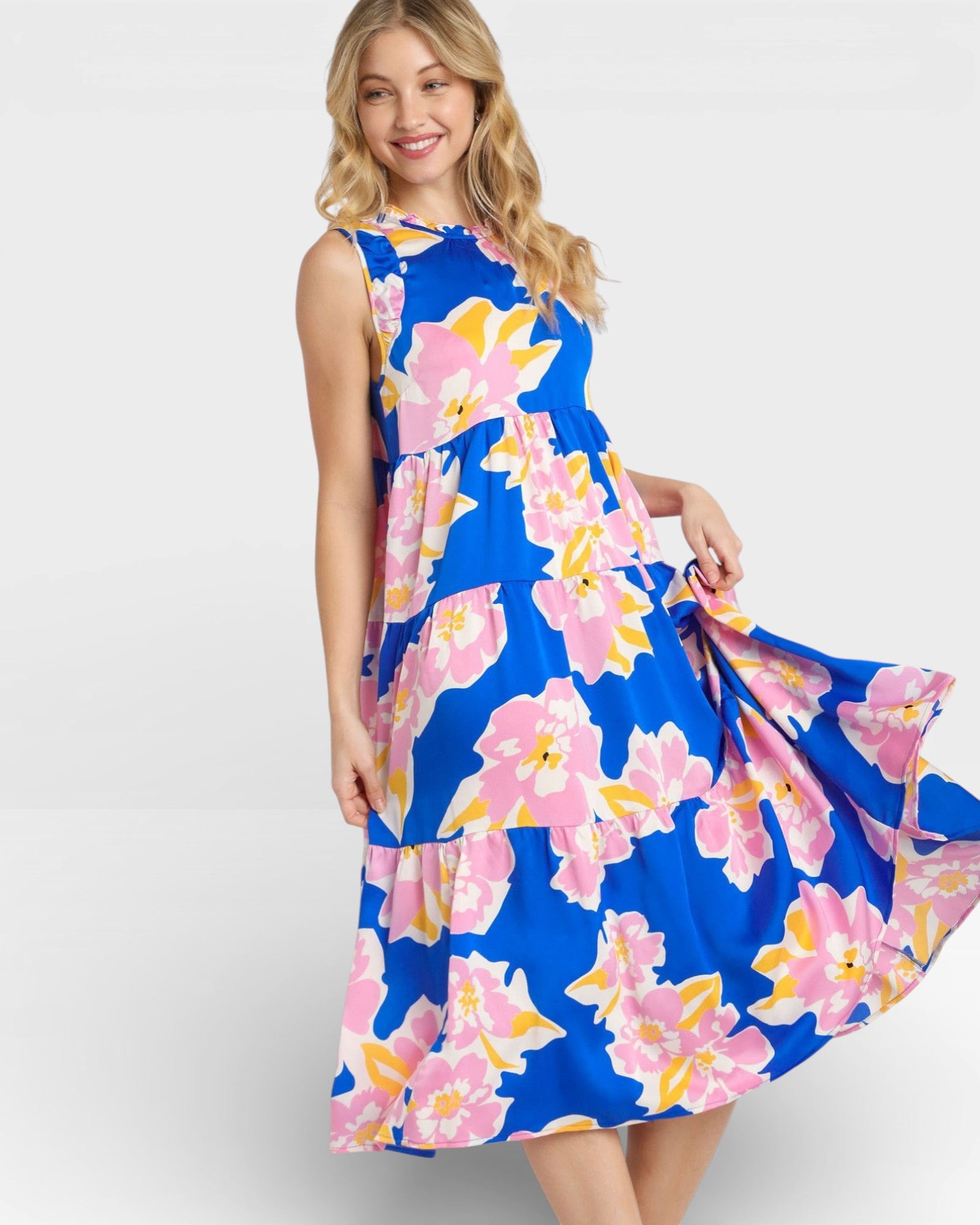 Woman wearing a blue floral dress on a white background