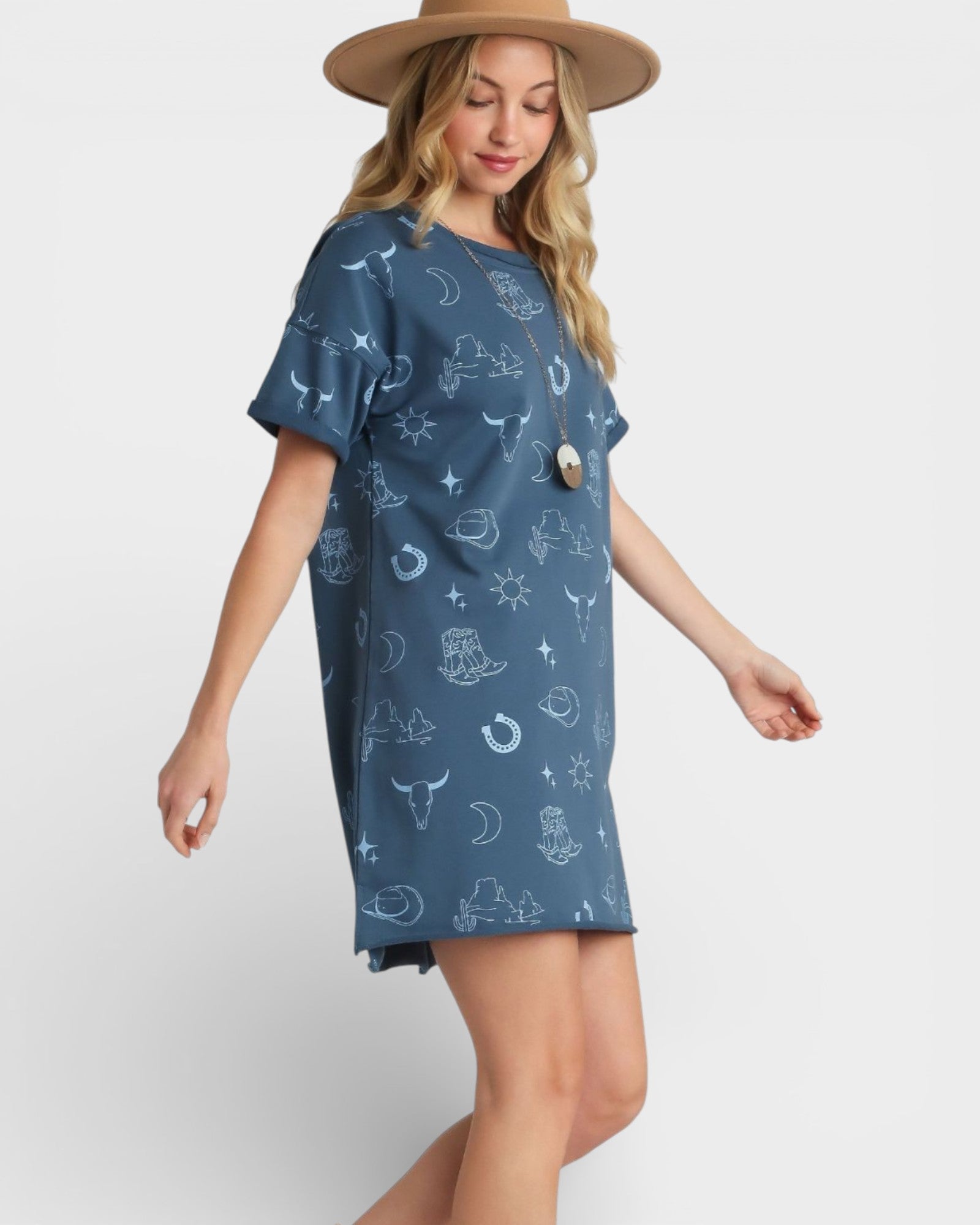 Woman wearing a blue dress with celestial pattern on a white background