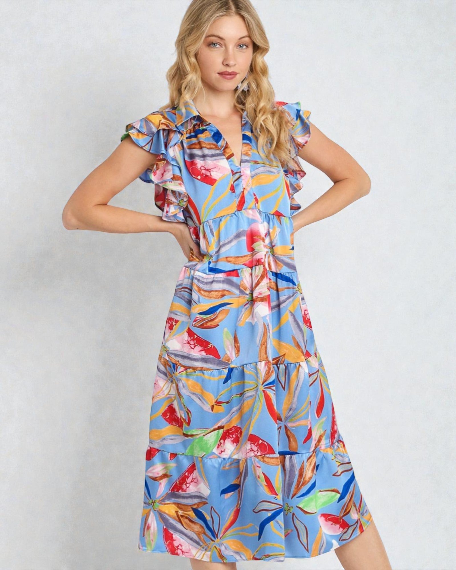 Woman wearing a colorful floral dress on a white background