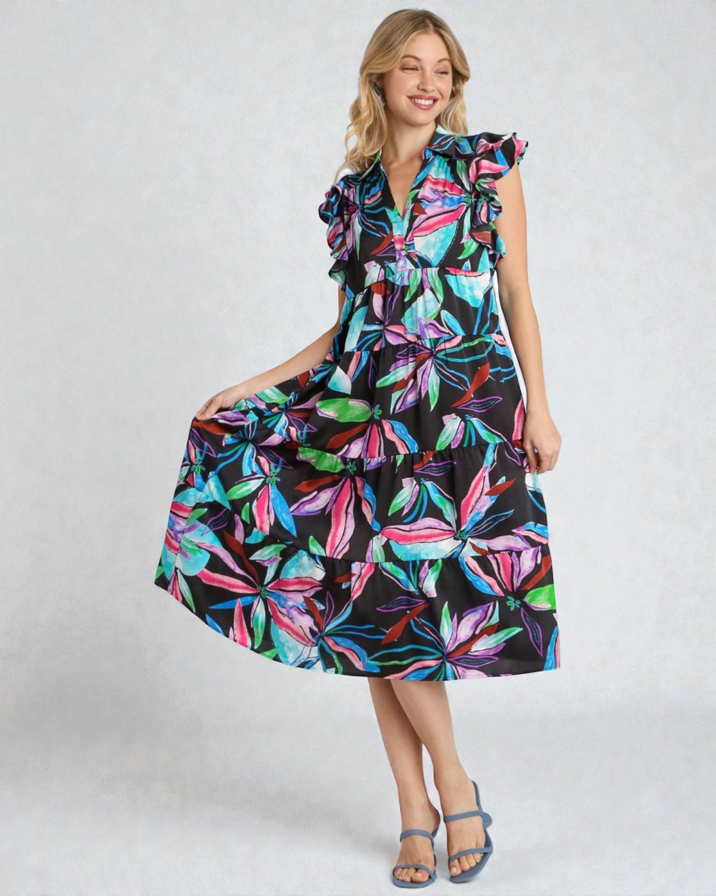 Woman wearing a colorful dress with a black background