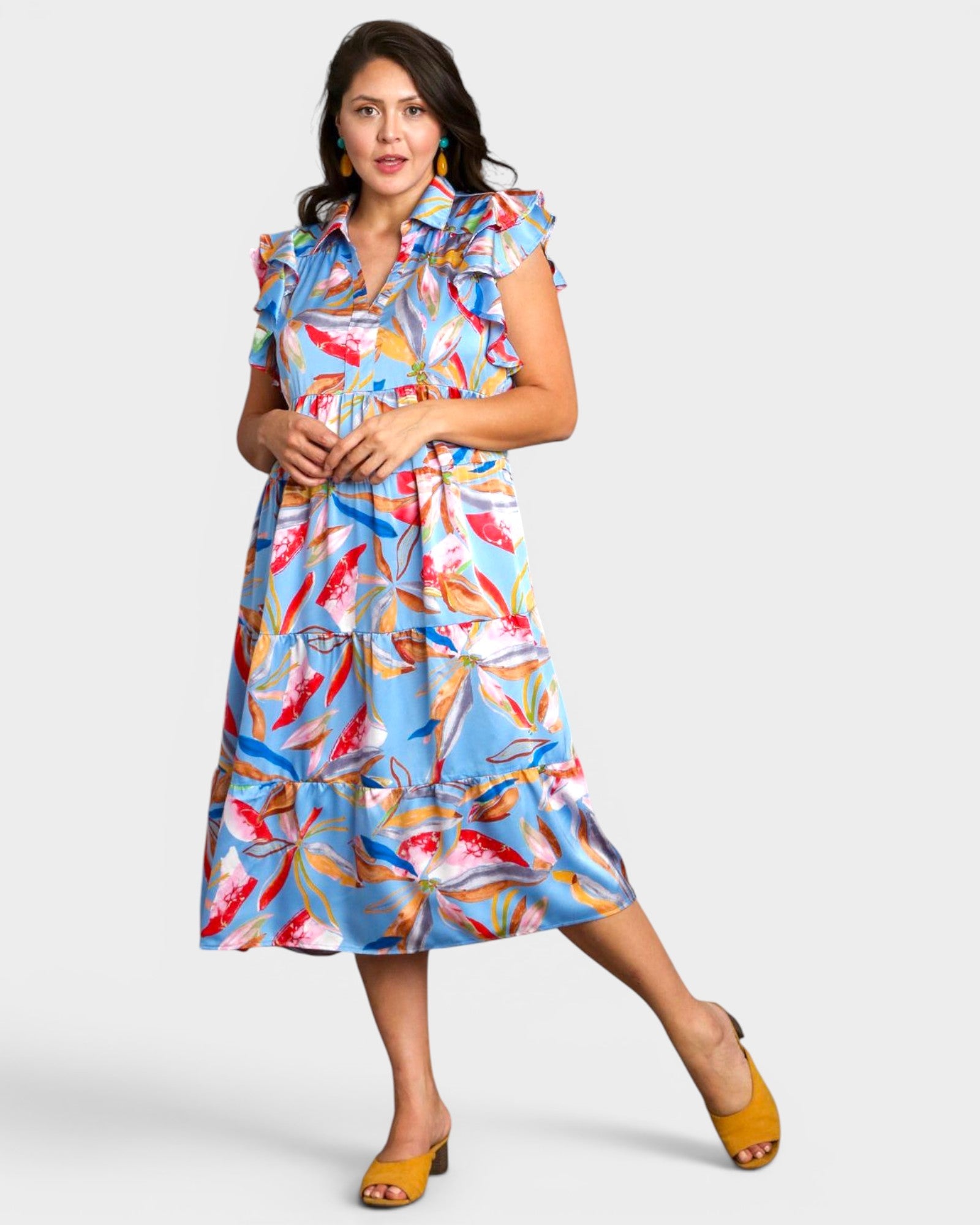 Woman wearing a colorful dress with a white background