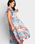 Woman wearing a colorful dress with a white background