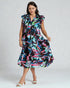 Woman wearing a colorful dress with a white background