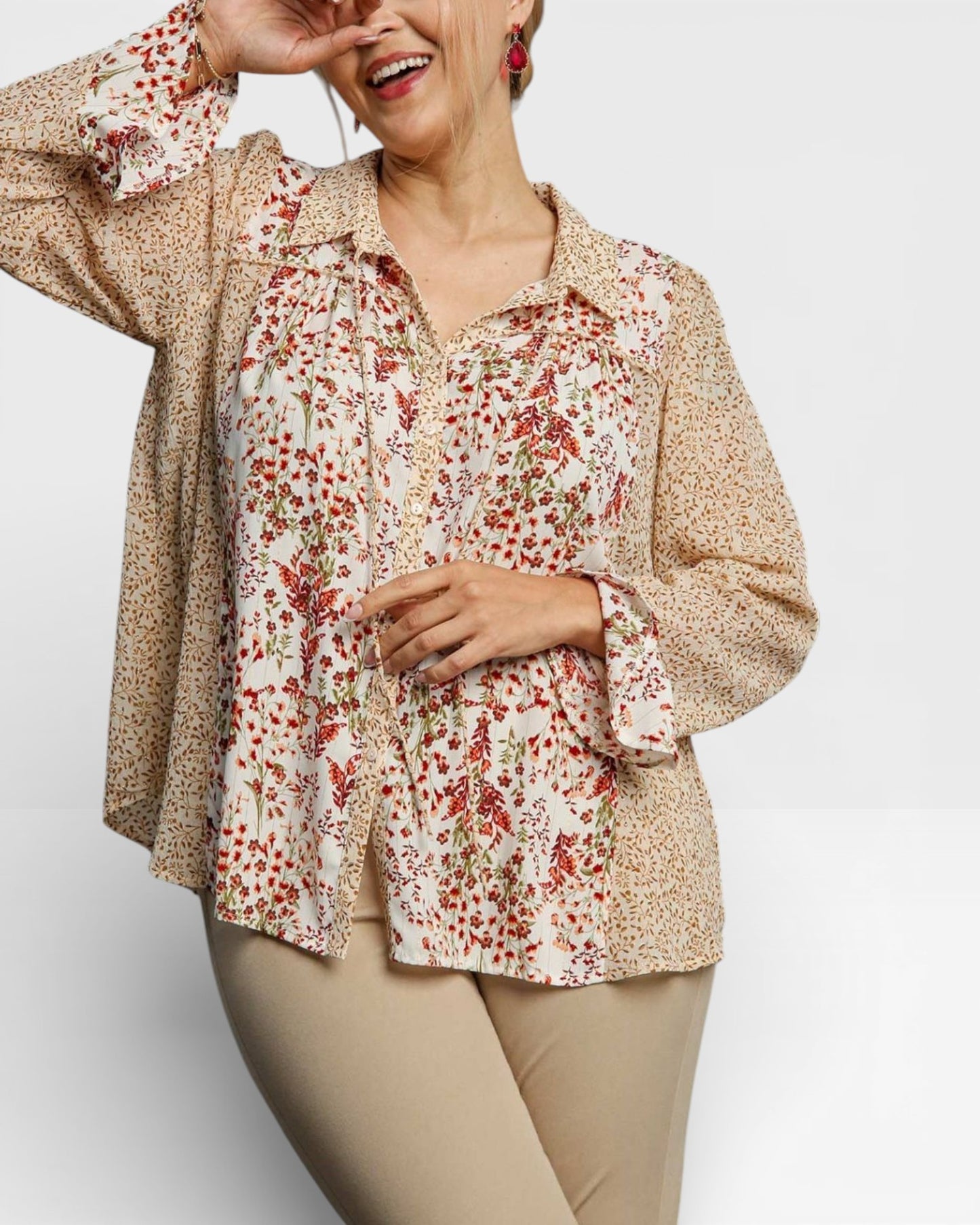 Woman wearing a floral blouse with a beige background