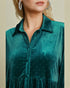 Teal velvet dress with rhinestone embellishments on a neutral background
