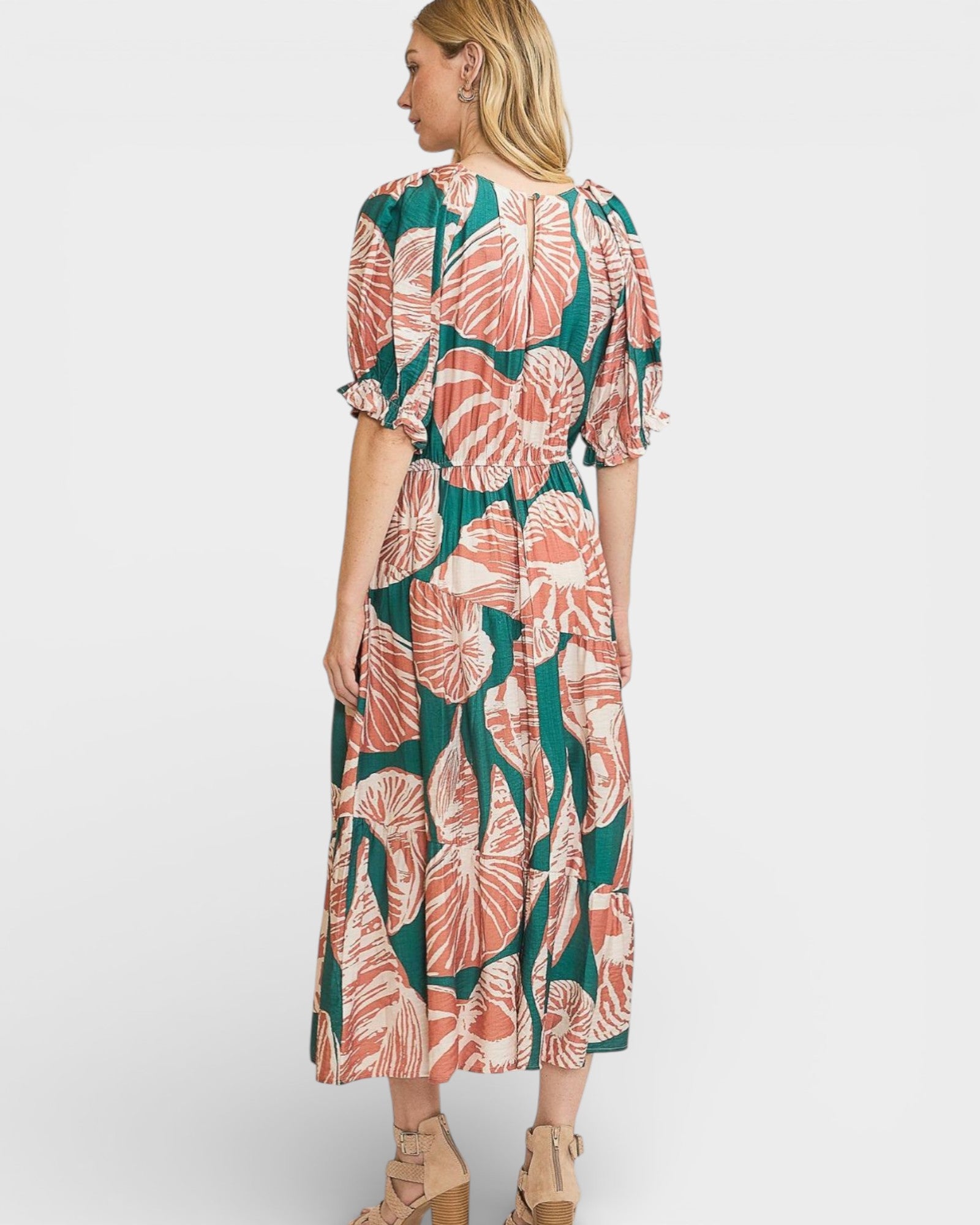 Woman wearing a floral dress on a white background