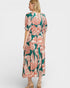 Woman wearing a floral dress on a white background
