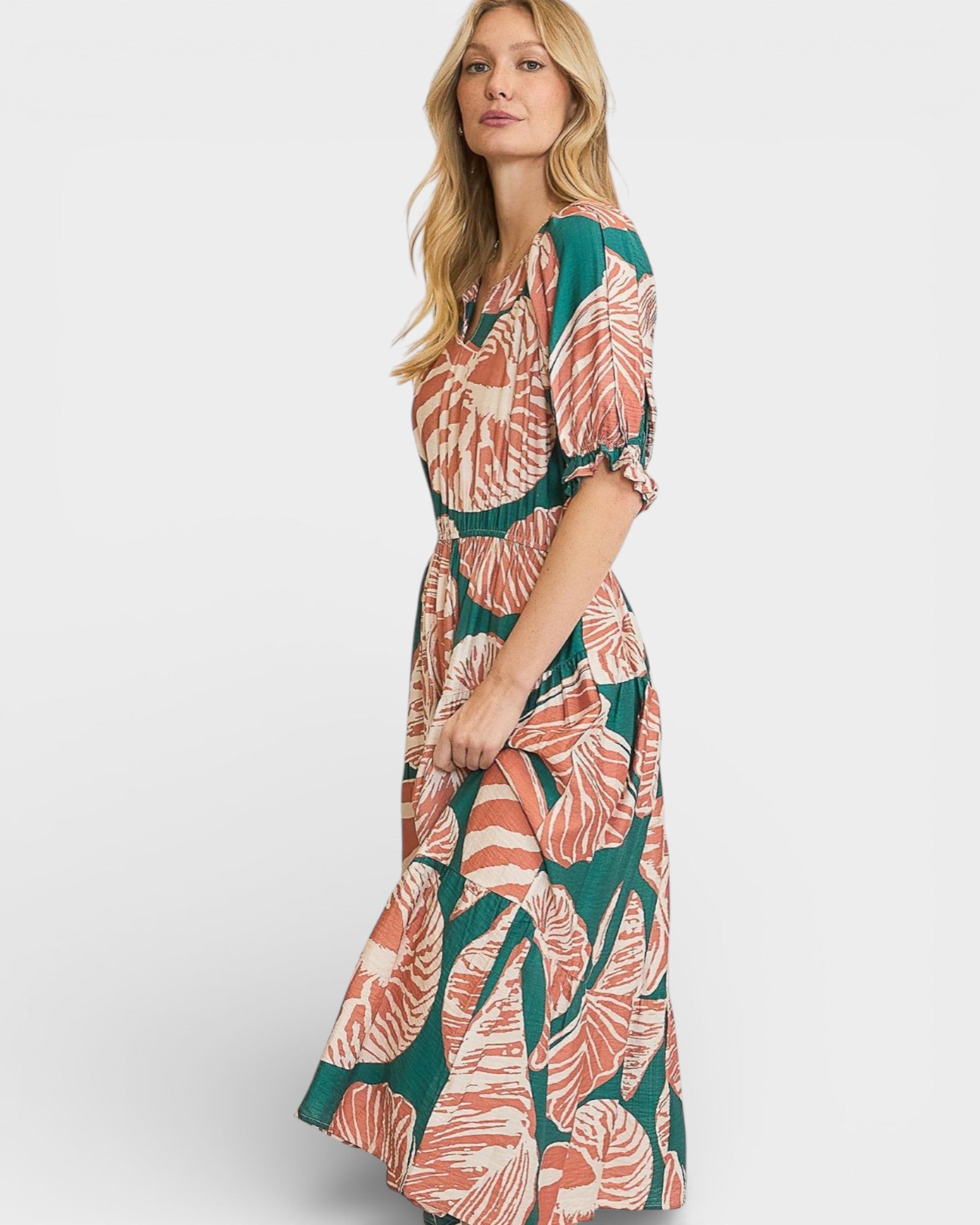 Woman wearing a floral dress on a white background