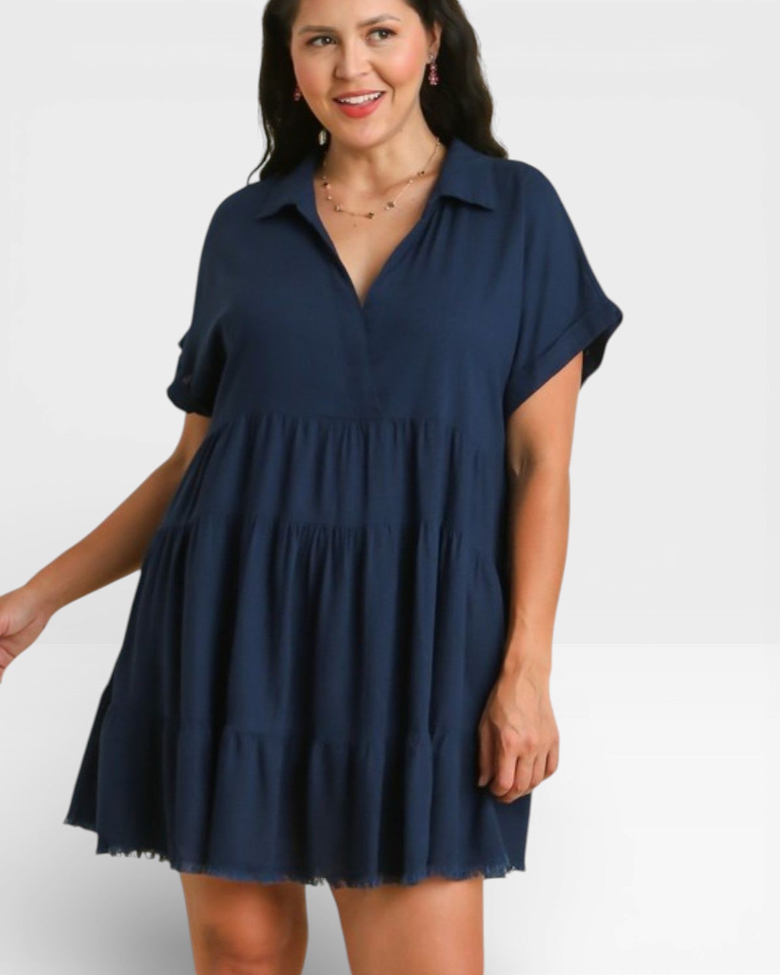Woman wearing a navy blue dress on a white background