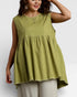 Woman wearing a green sleeveless top on a white background