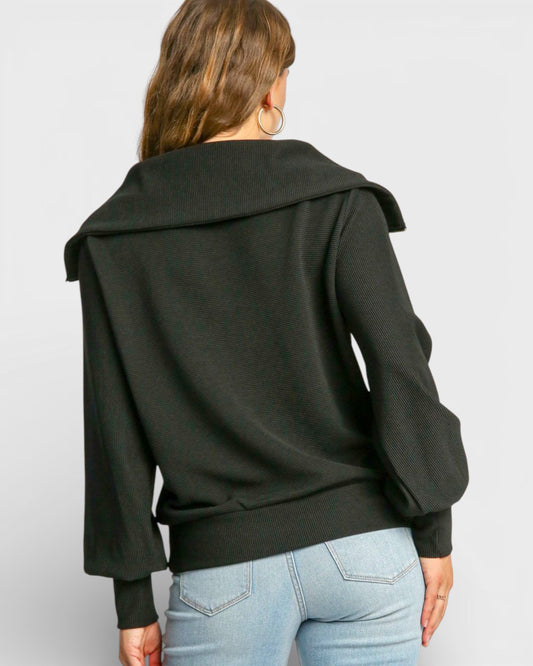 Person wearing a black jacket with a white background