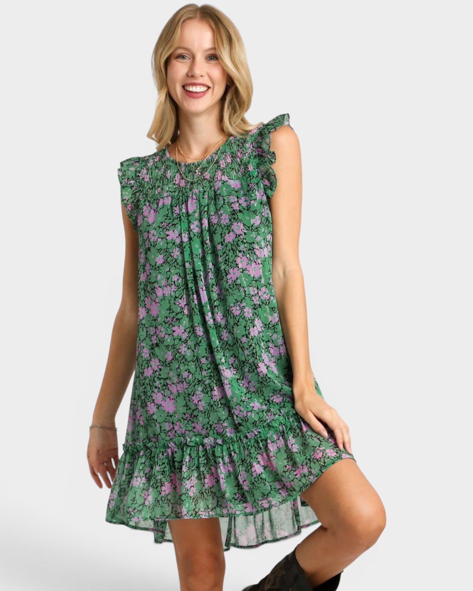Green floral dress with purple flowers on a white background