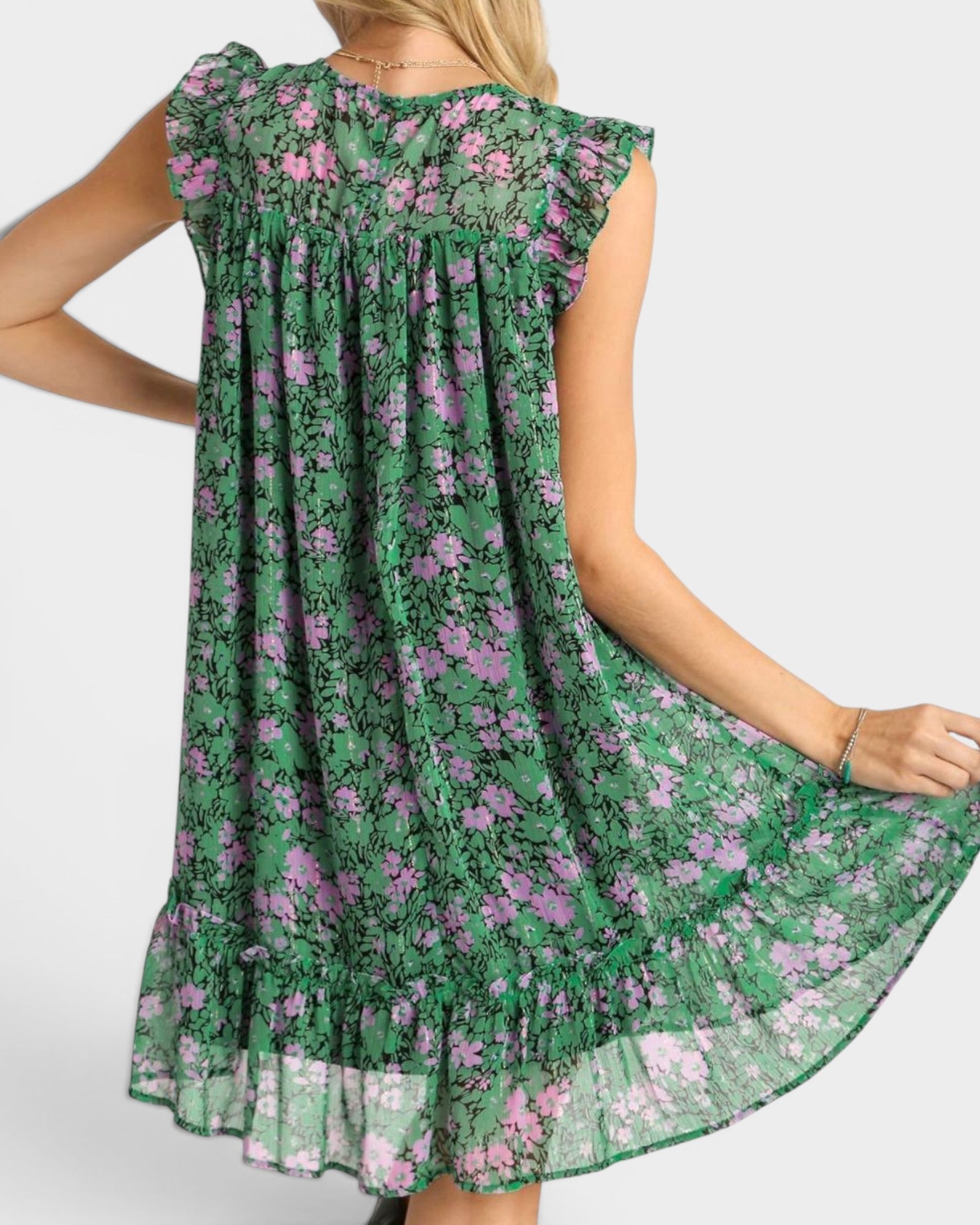 Green floral dress with purple flowers on a white background