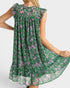 Green floral dress with purple flowers on a white background