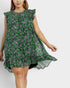 Woman wearing a green floral dress on a white background