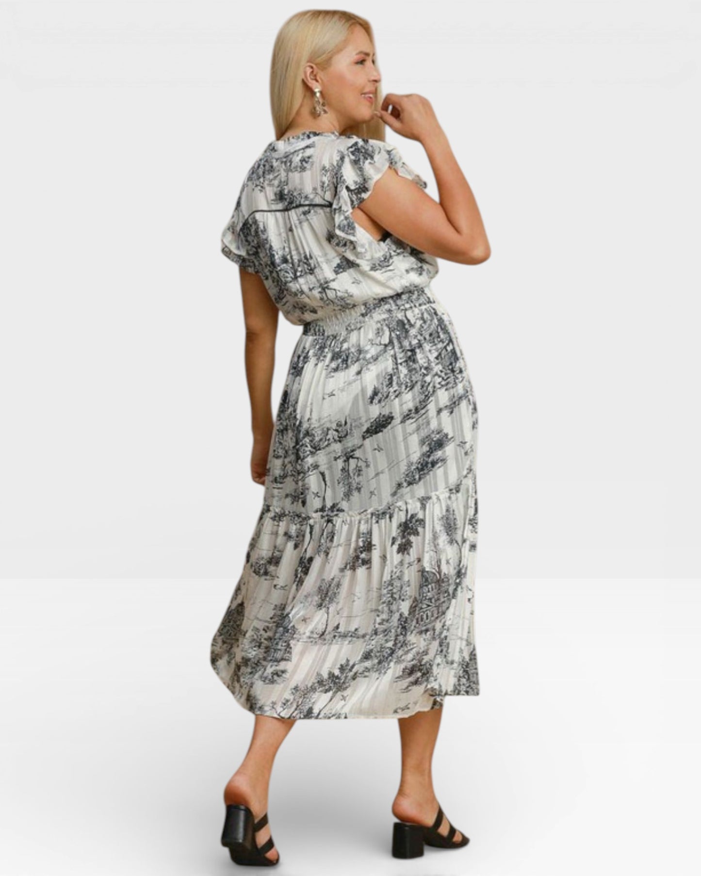 Woman wearing a floral dress on a white background