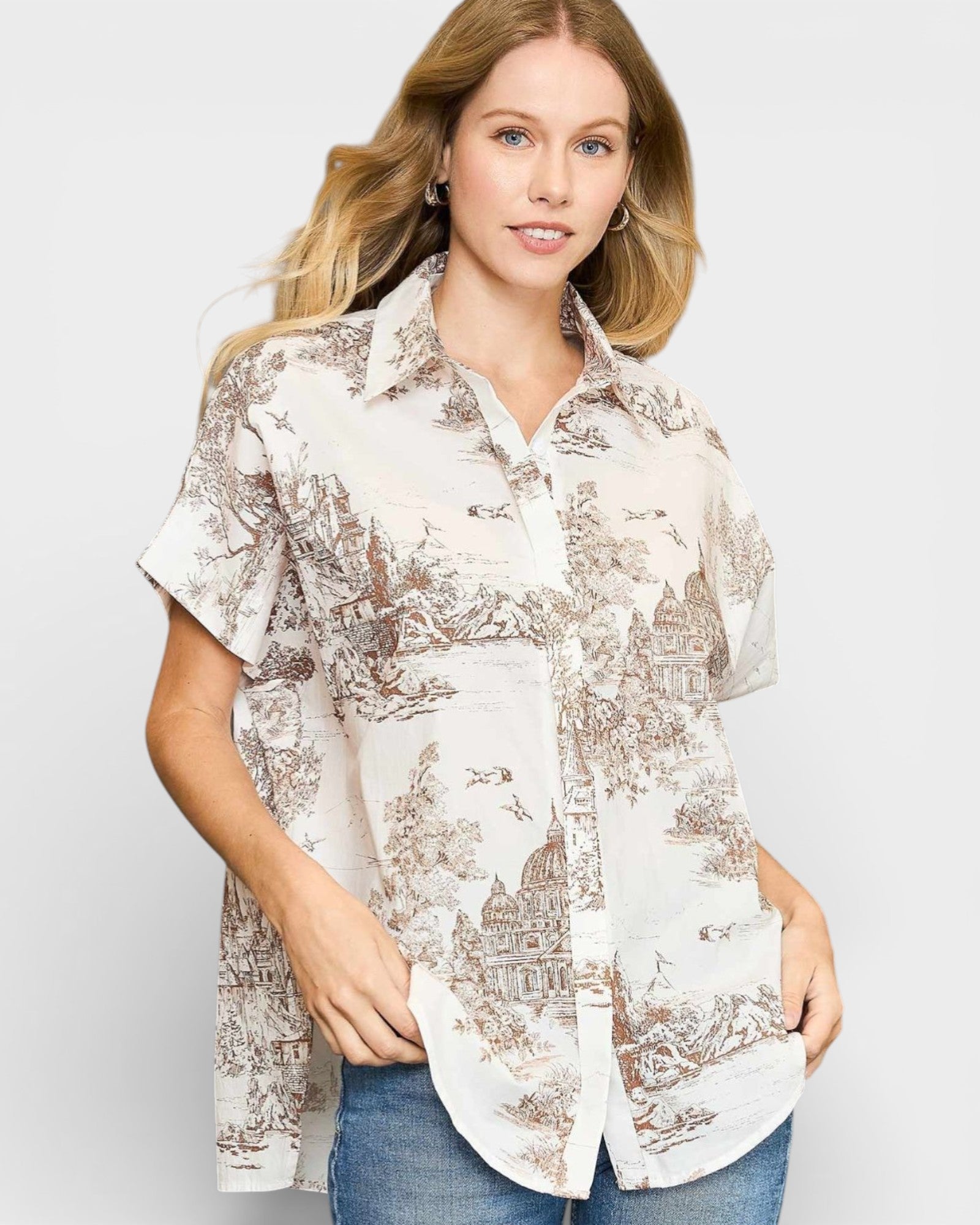 Woman wearing a patterned shirt with a plain background