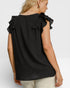 Black top with ruffled shoulders worn by a person on a white background