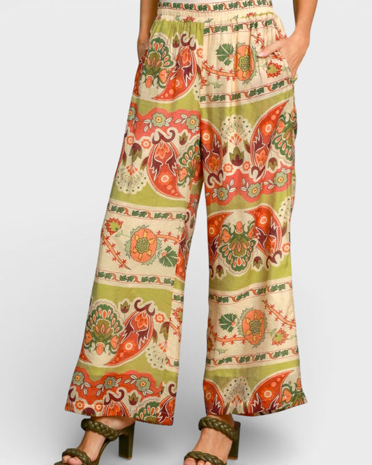Colorful patterned pants on a plain background