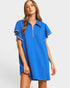 Woman wearing a blue dress with a white background